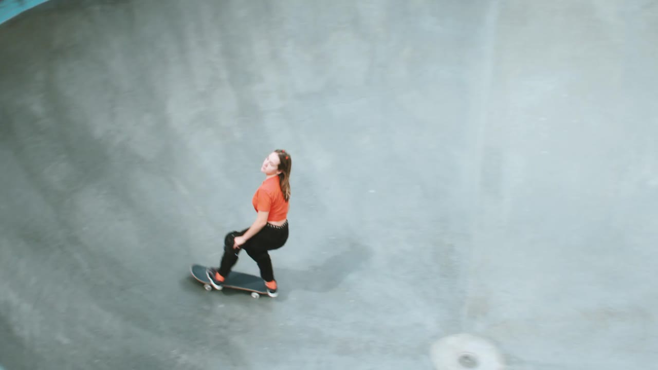 A skateboarder riding a concrete bowl in the Vans brand film